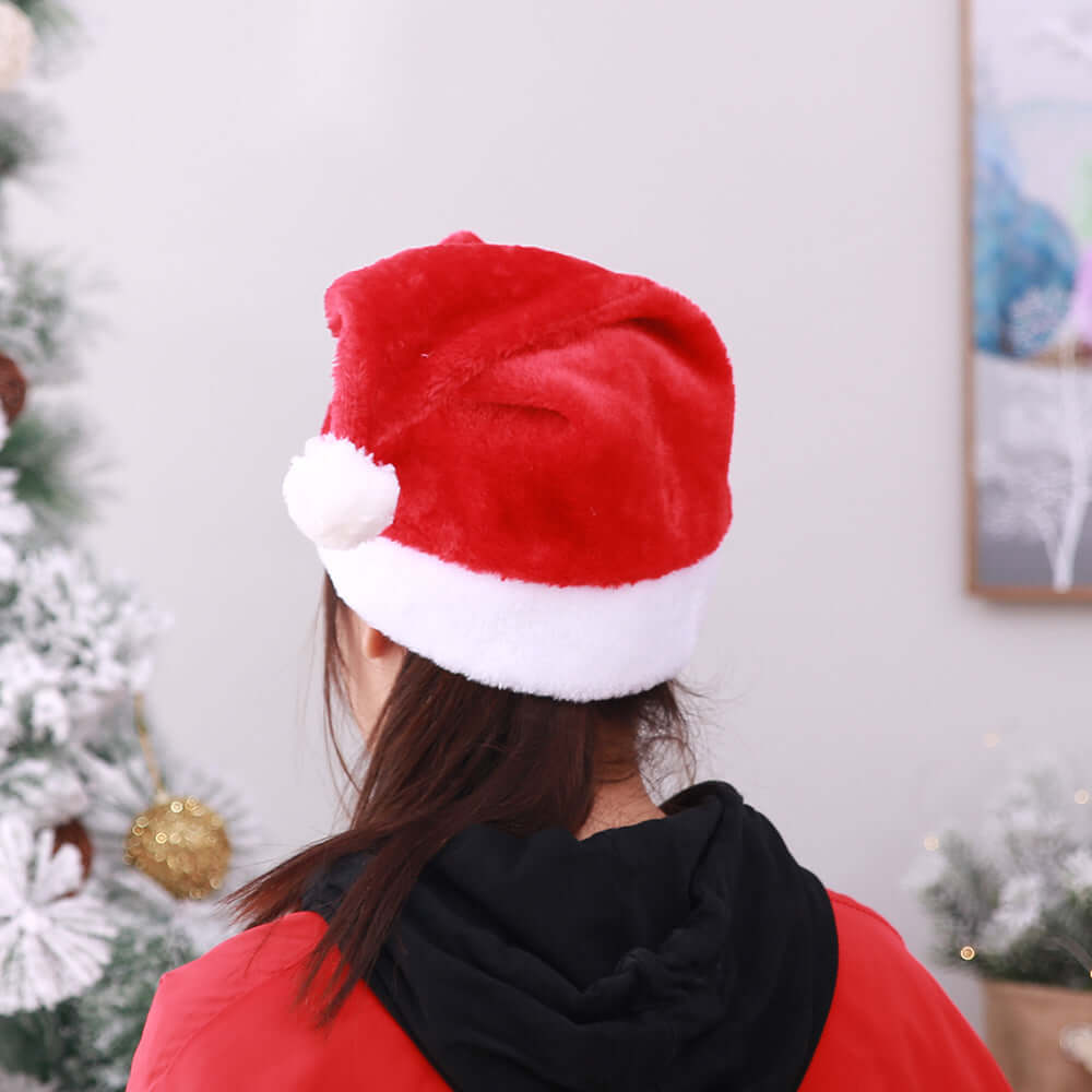 Christmas Short Plush Hat worn by a person with a festive backdrop, ideal for holiday celebrations.